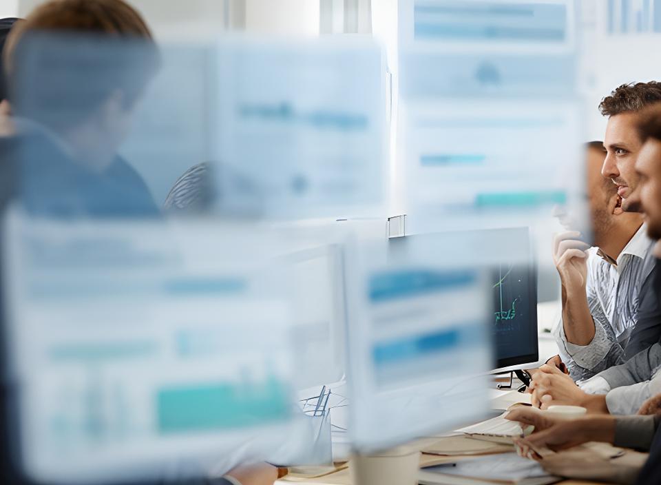 Finance team reviewing an AI budget dashboard in a Palo Alto office with charts and forecast panels